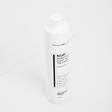 White bottle of Colorlab Relief Shampoo on a white background